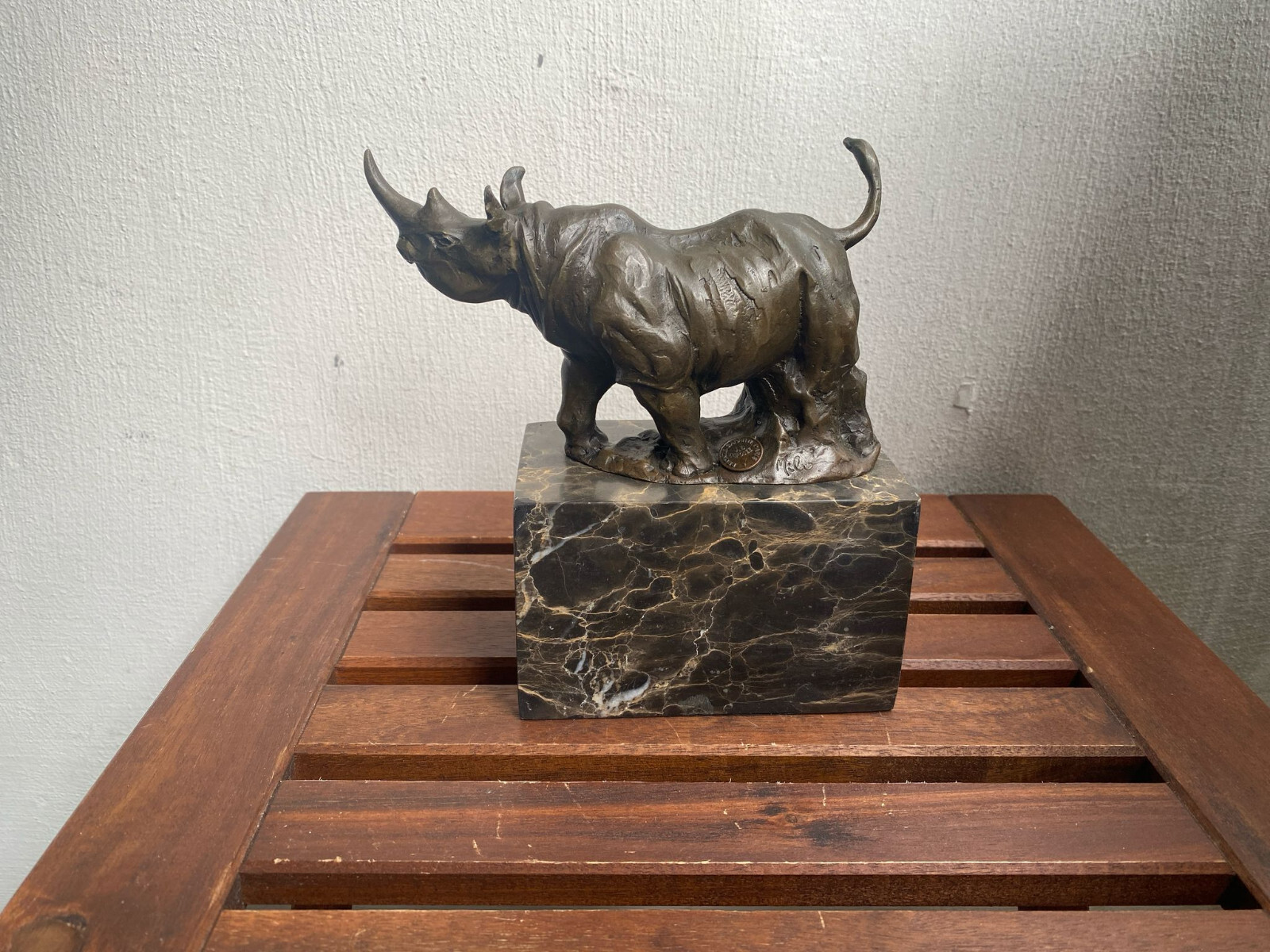 Bronze sculpture Walking Rhinoceros on a black marble base after Milo