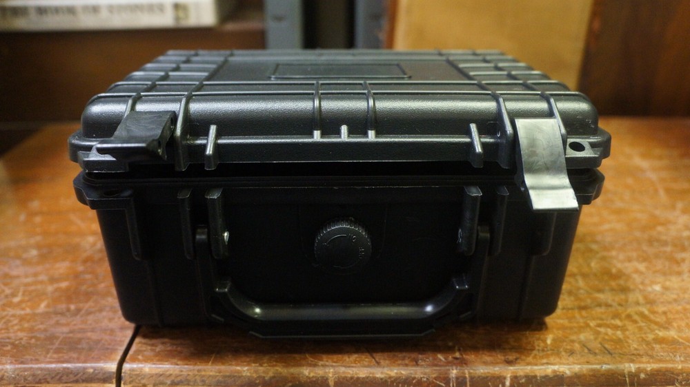 NICE BLACK HARD PLASTIC BOX WITH 20 GRADED COIN SLOTS--DOESNT LOCK TABS SECURE