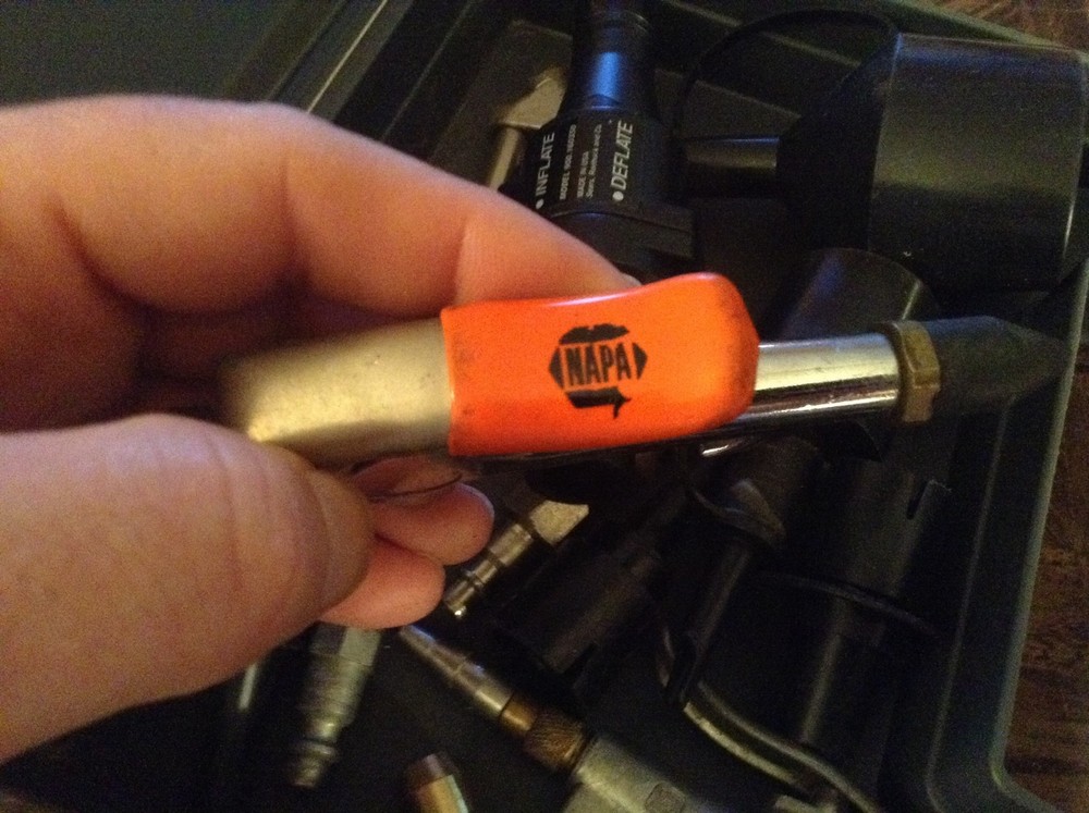 Plastic case full of air attachments etc.