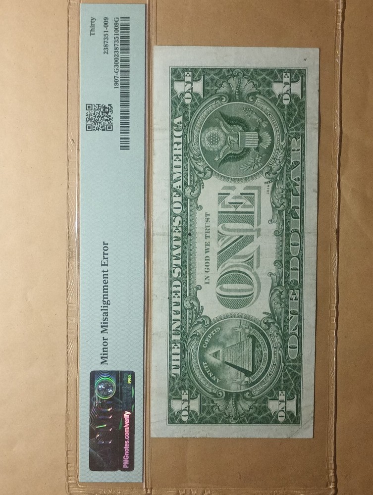 grated 1969 $1 bill. Miss alignment error