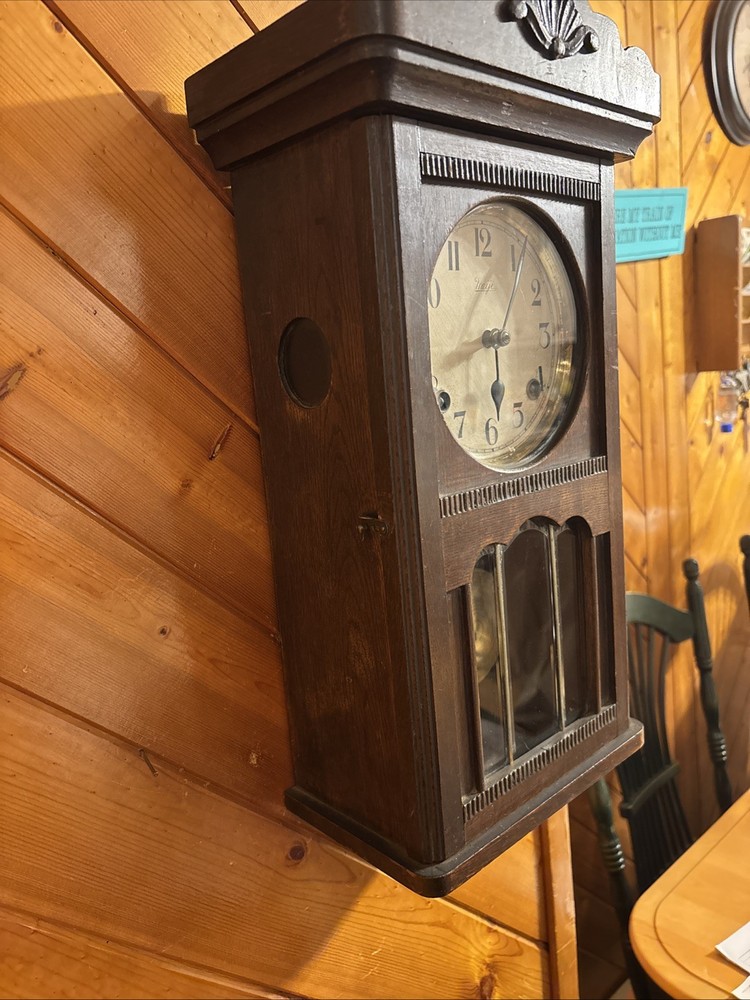 Vintage spring pendulum clock made by Meiji Clock Co.