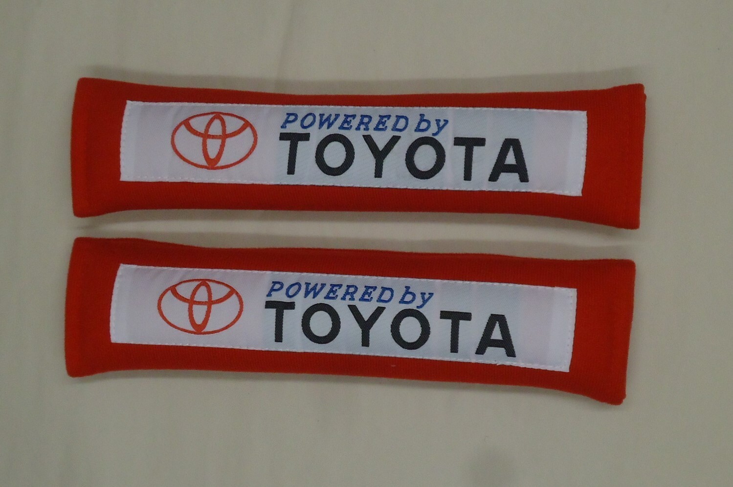 2x New Red Car Seat Belt Cover Shoulder Pads "Powered by Toyota" 10.5"x2.5"