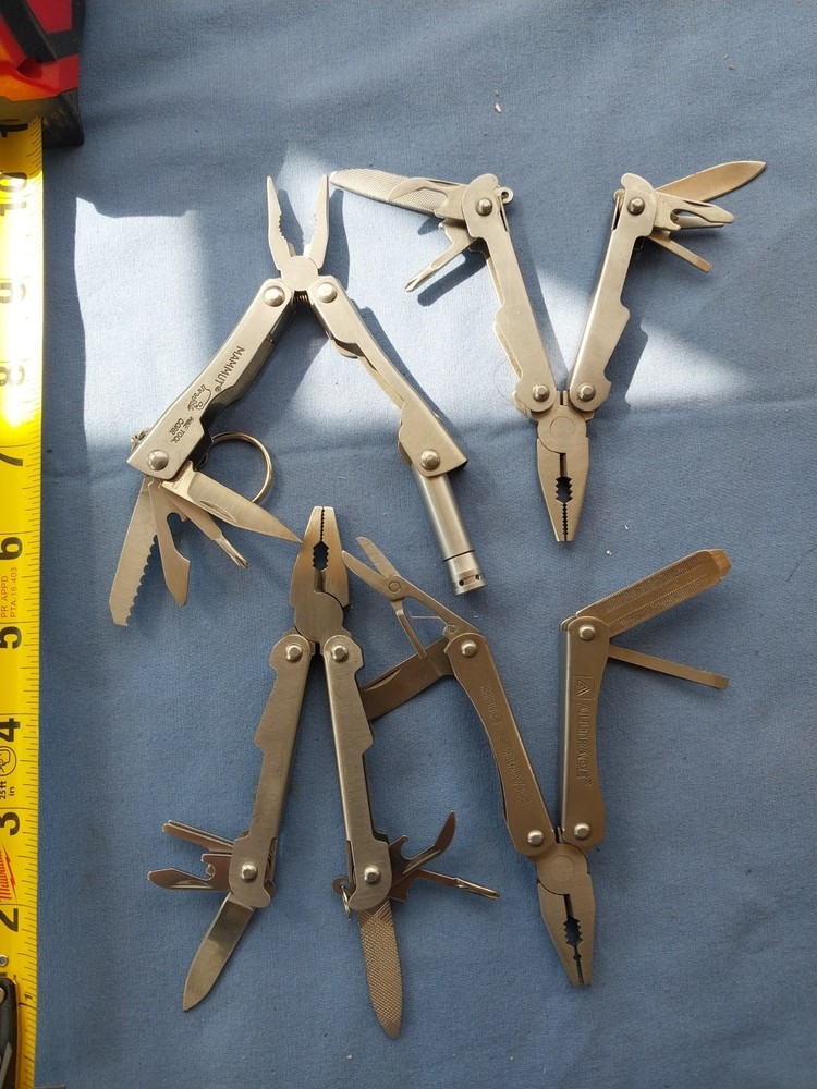 4 small multitudes with pliers knife scissors screwdriver's