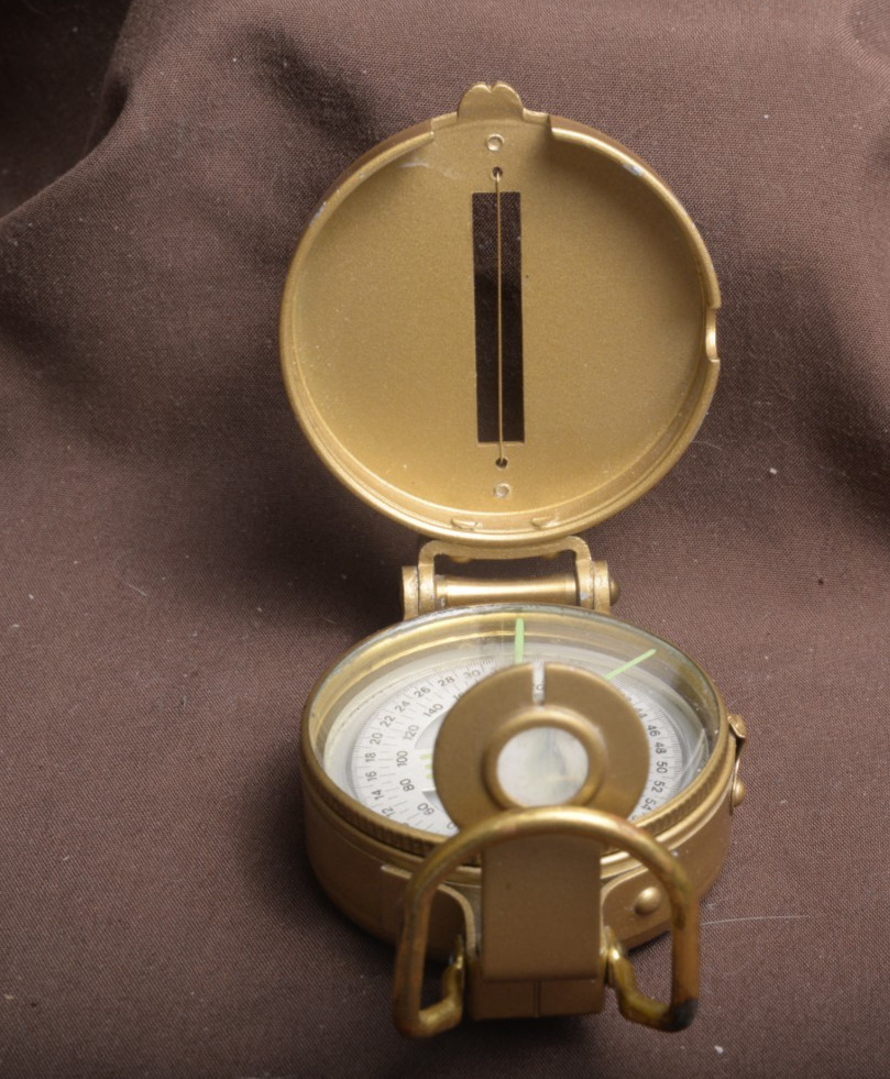 two lensatic compasses one with box