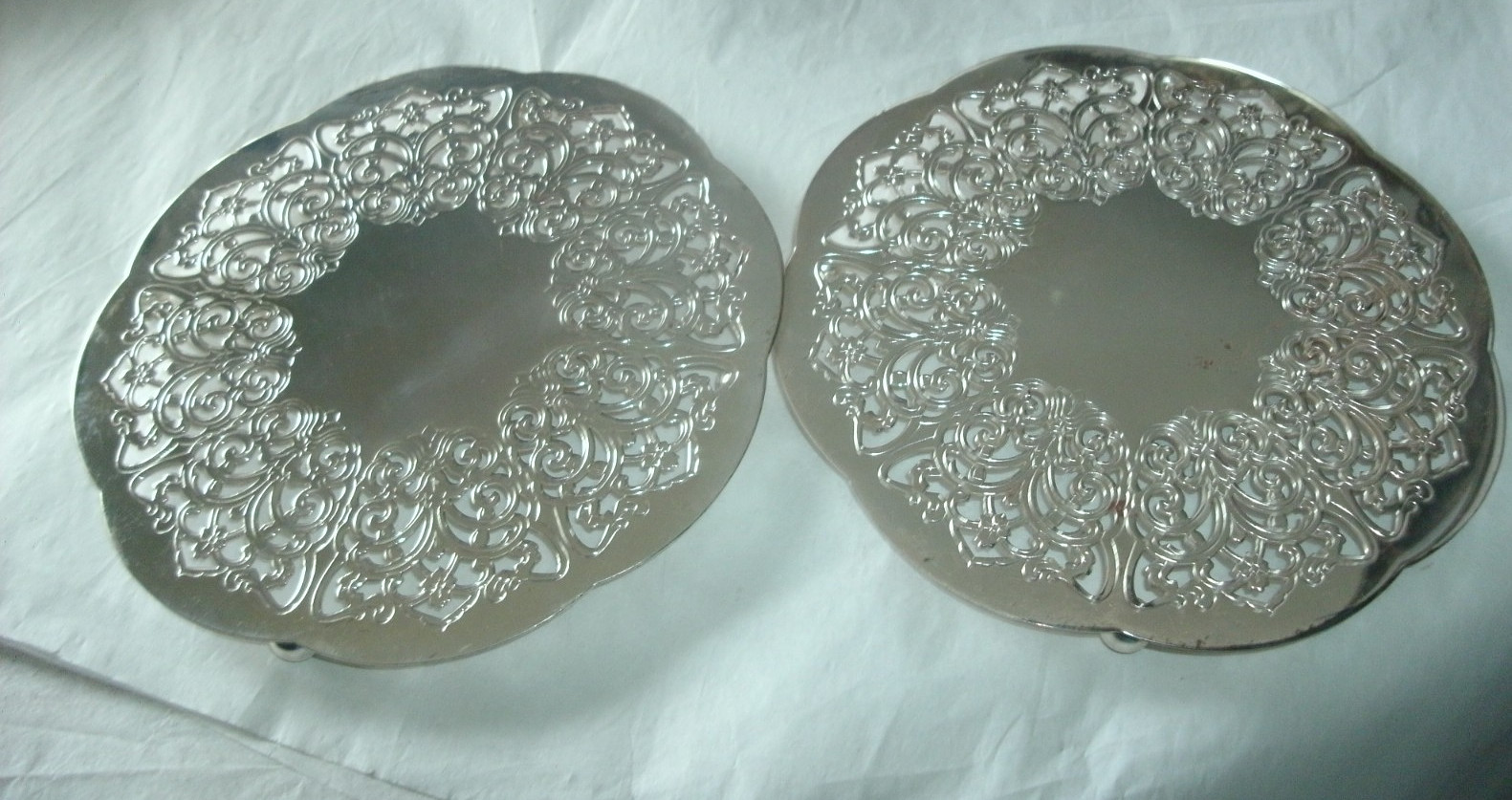 2 VINTAGE FOOTED SILVERPLATE TRIVETS, MADE IN WESTERN GERMANY, 6"