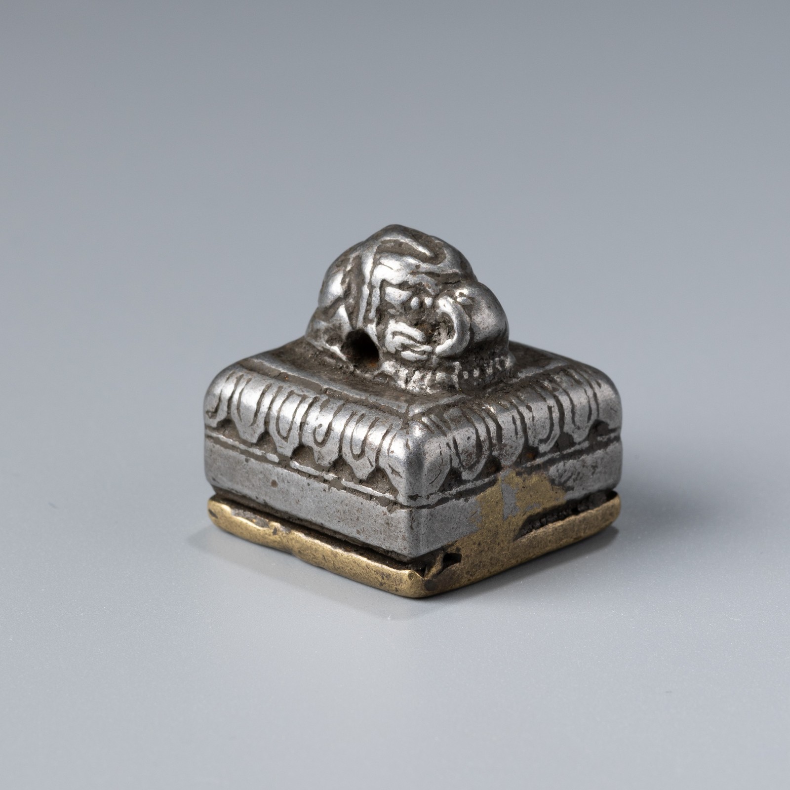 Tibetan Bronze and Iron Seal with Conch Motif