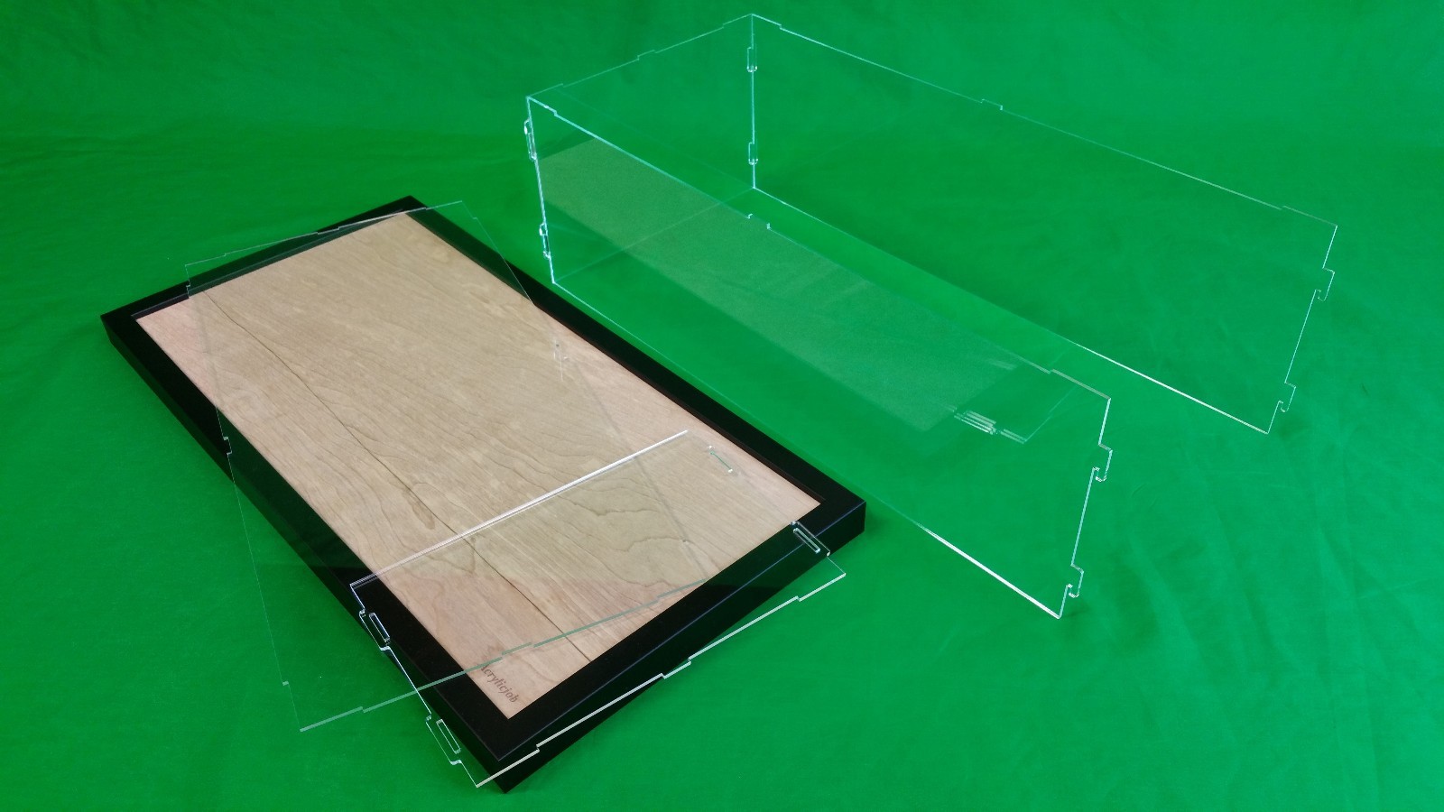 36"L x 10"W x 12"H Display case with 3/16" thick acrylic black wood frame base