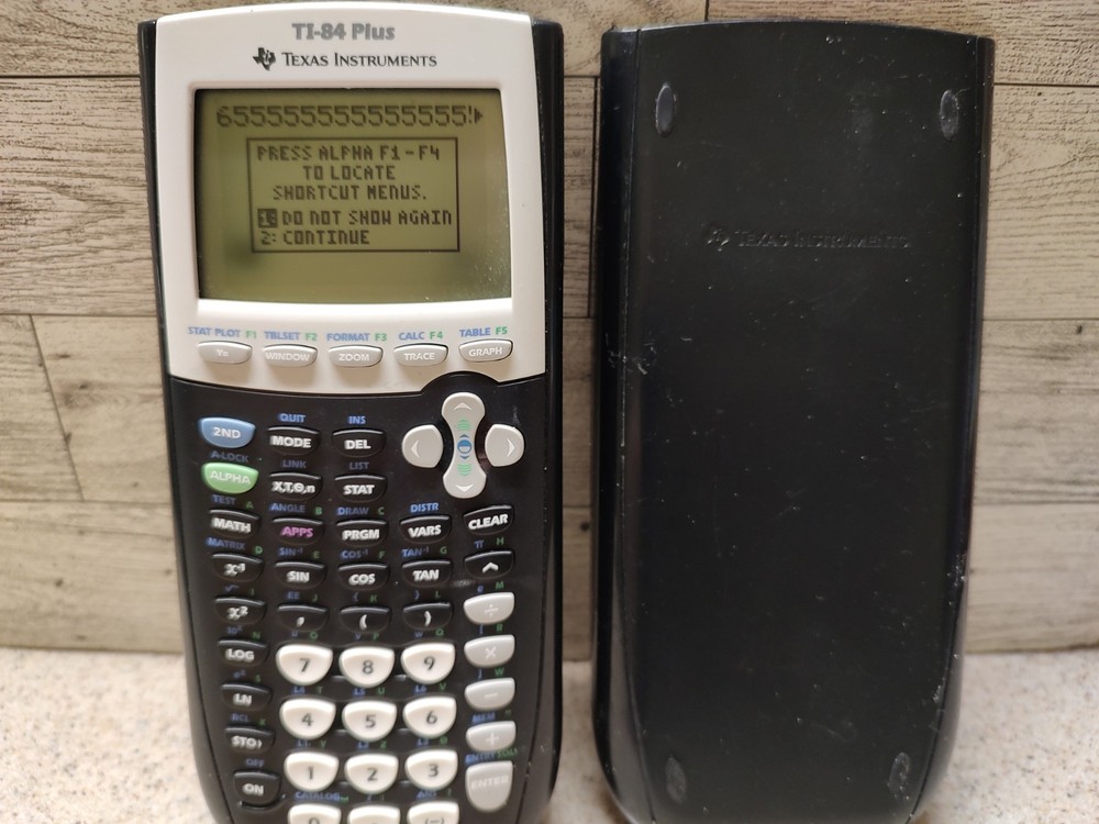 Texas Instruments TI-84 Plus Graphing Calculator - Black Tested Small Dark Spot