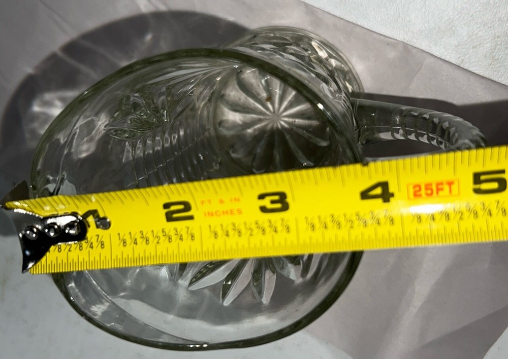 Cut glass pitcher 5 1/4" and 3 1/2" Diameter