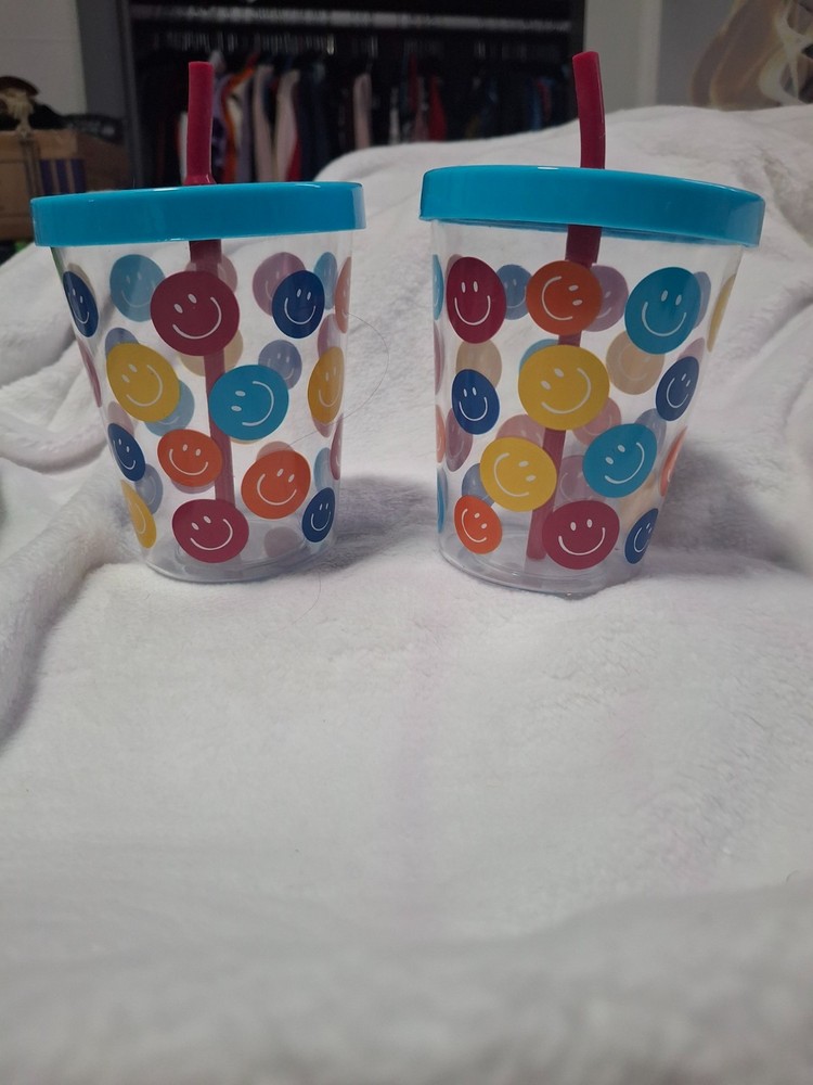 Plastic cups with straws