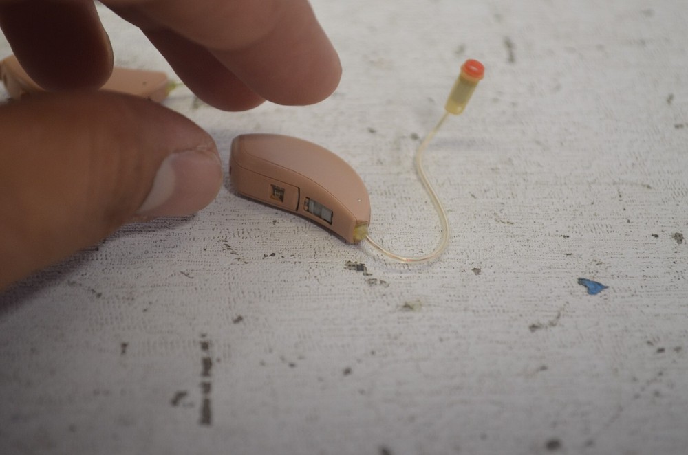 Resound Hearing Aids as is not tested missing button , might affect function