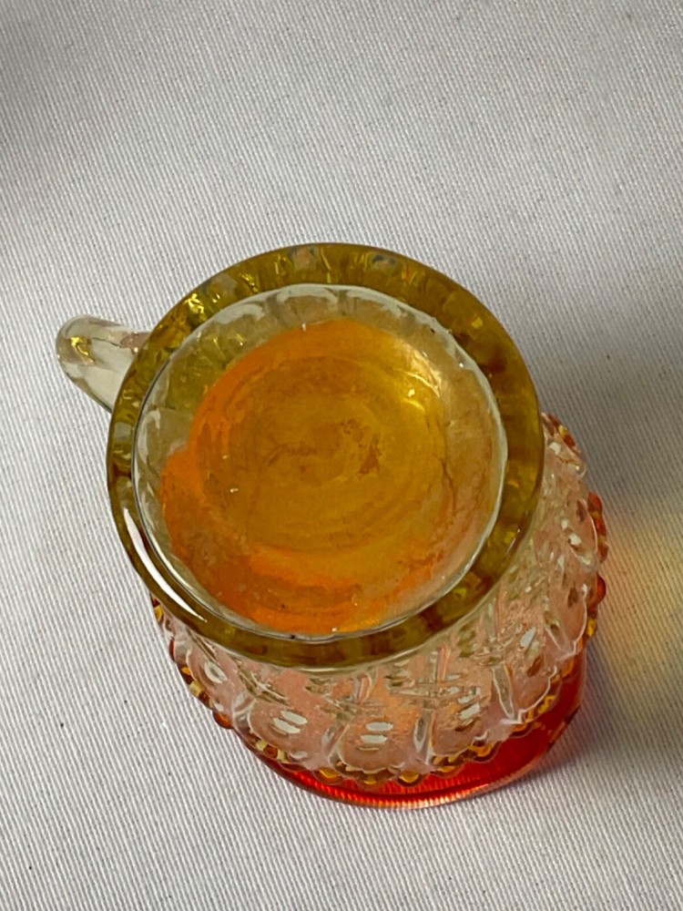 multicolor Amberina glow small glass pitcher 4”