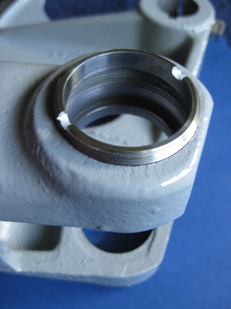 SPANNER NUT FOR RETAINING THE FIXED BEARING IN A DELTA UNISAW ARBOR CASTING.