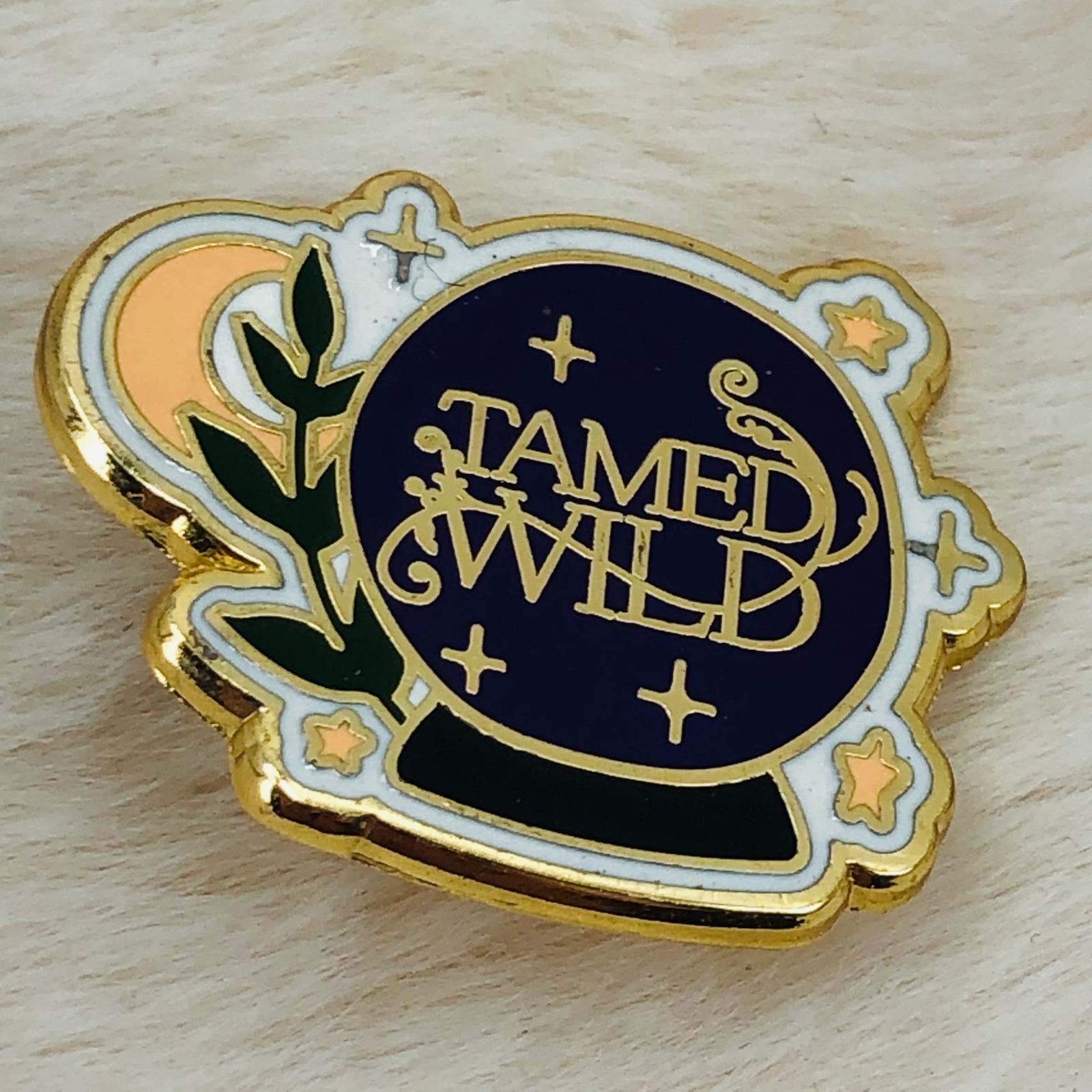 Tamed Wild Crystal Ball Enamel Advertising Lapel Pin