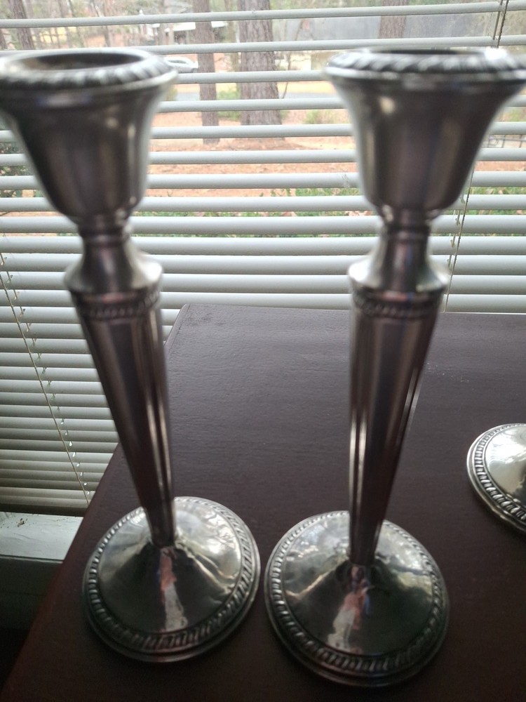 A rare Pair Of Sterling Silver Candelabras By CROWN. 8 In. Tall.