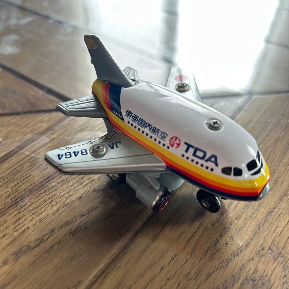 TDA miniature airplane tin