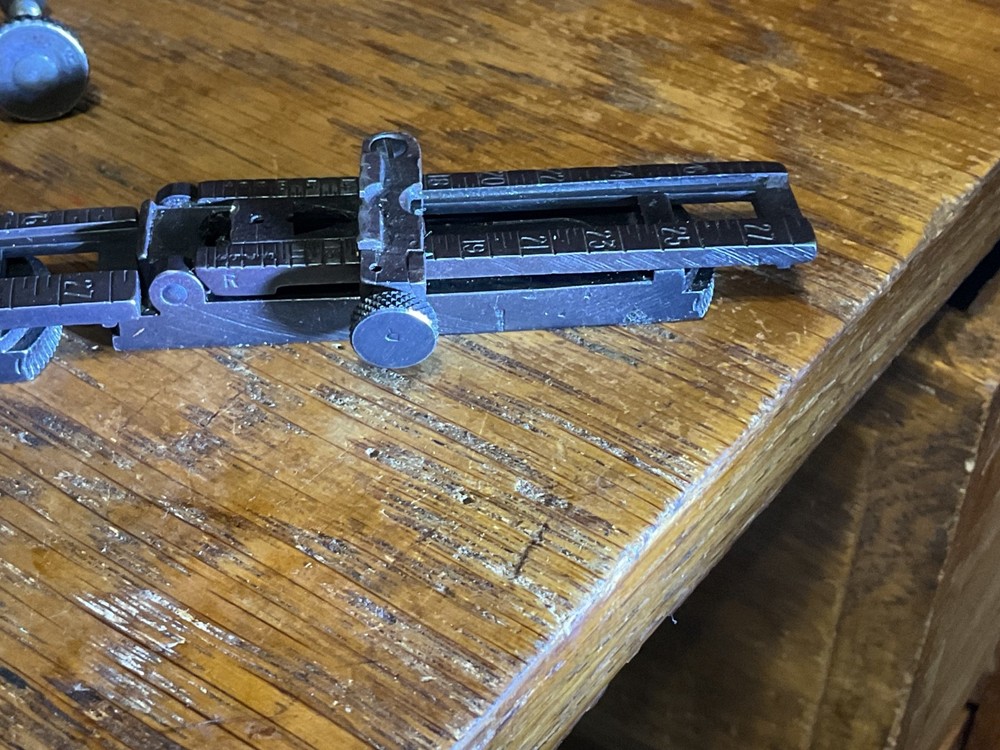 Remington 1903 sight base, leaf, slide, elevation, windage knobs marked R. 1 set