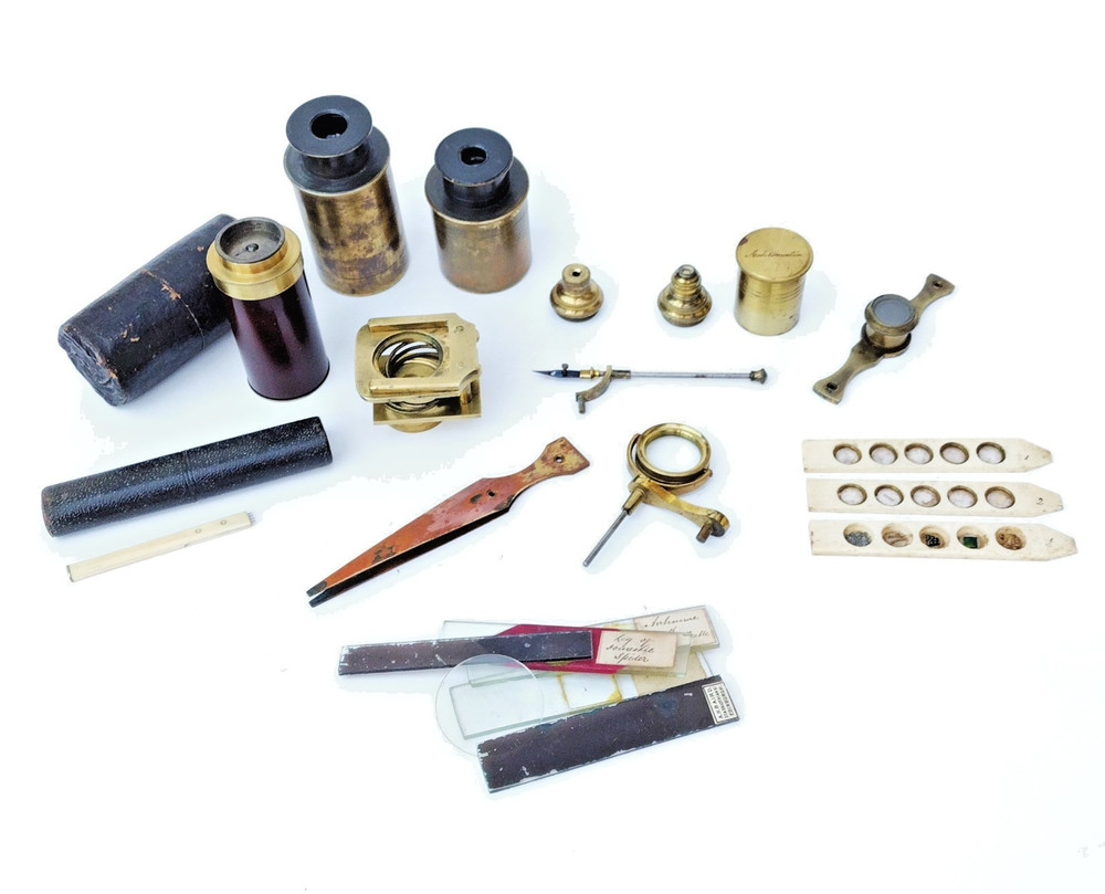 Brass microscope in case.