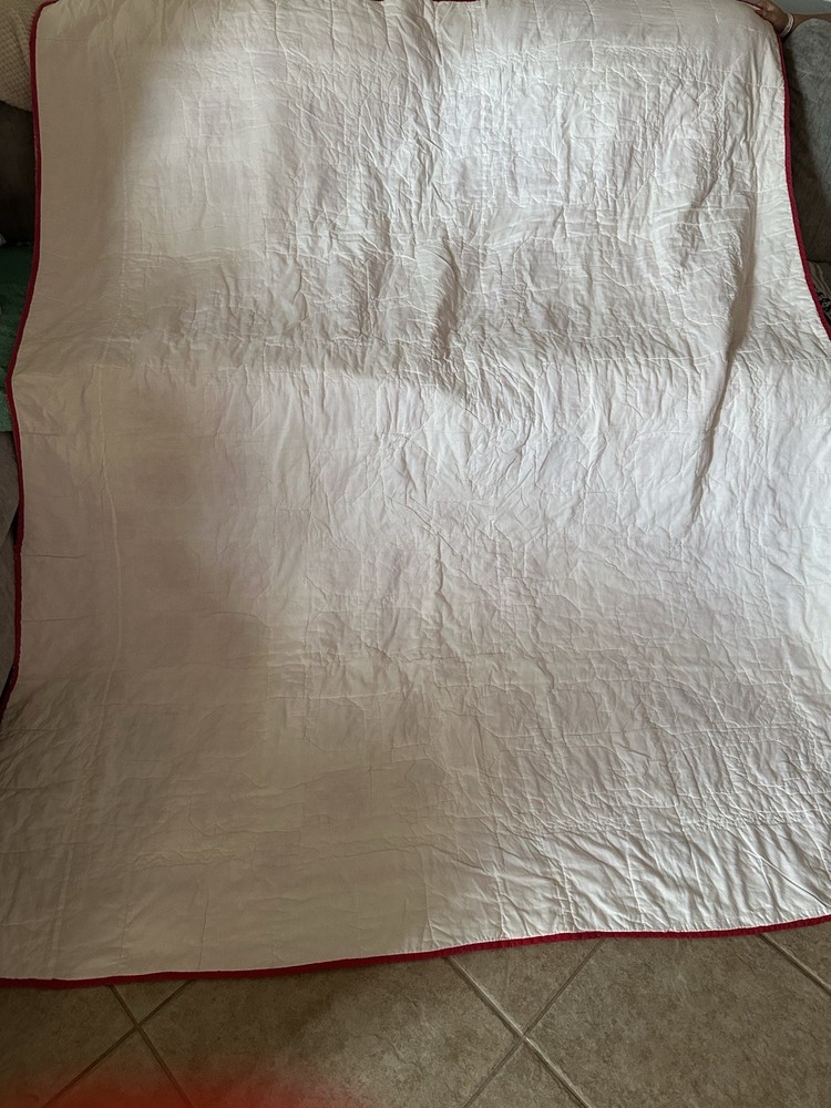 Cutters handmade red and white "Bear Paw" pattern quilt.