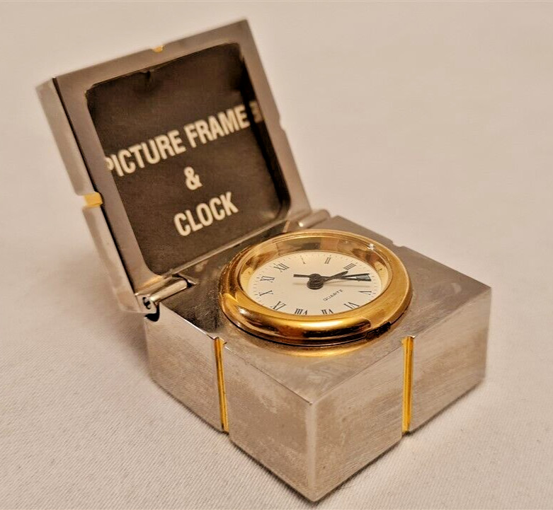 Gift mini clock with silver picture frame hidden inside gold trim