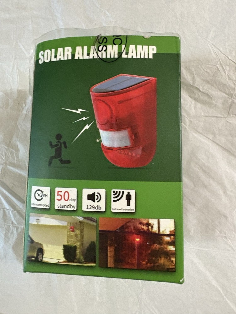 Motion activated solar alarm lamp