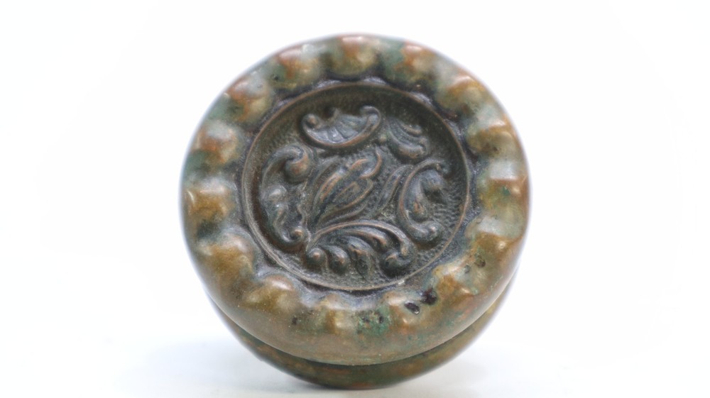 Two "Eulalia" pattern Reading Hardware Company (RHCo) door knobs, antique brass
