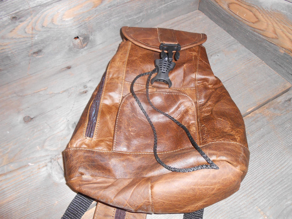 Leather backpack.New small to medium sized backpack spacious with zipper pockets