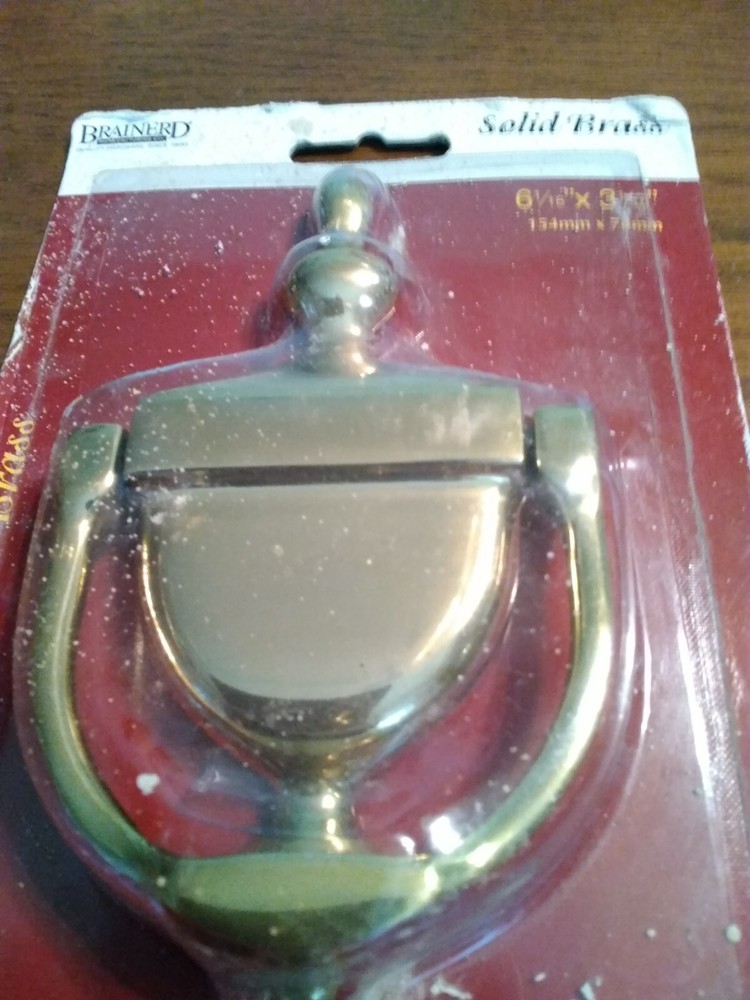 Brass Door Knocker. Unopened, but packaging rough. Solid.