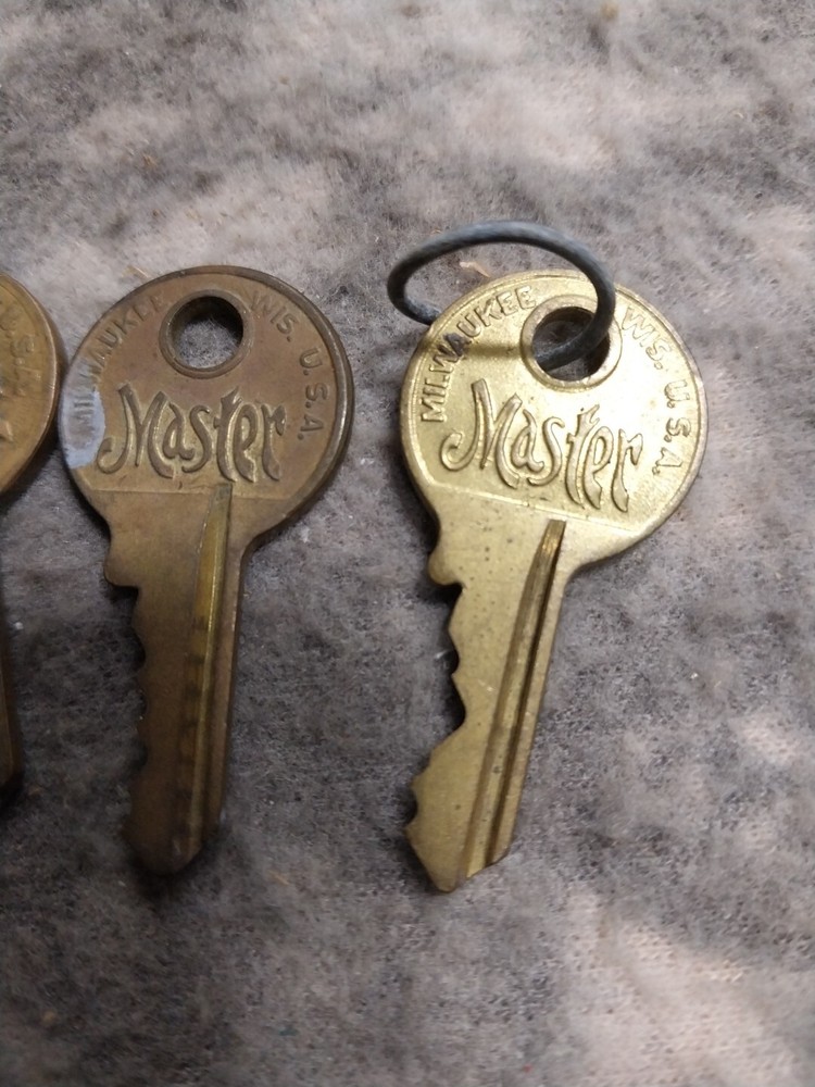 3 old master lock keys