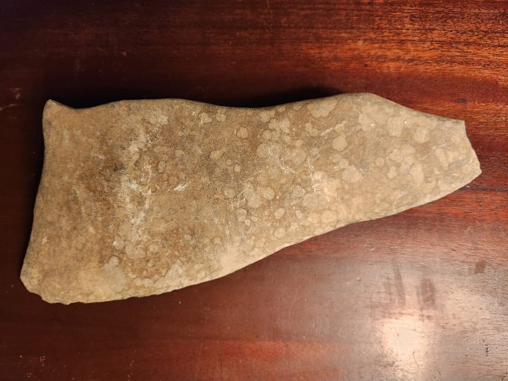 Large triangular Neolithic stone axe head from Niger