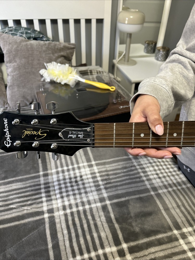 guitar, amp, and stand combo