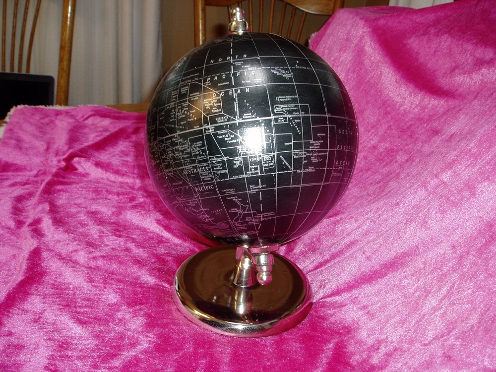 "DECORATIVE ROTATING DESKTOP WORLD/OCEAN GLOBE", black & silver, metal base
