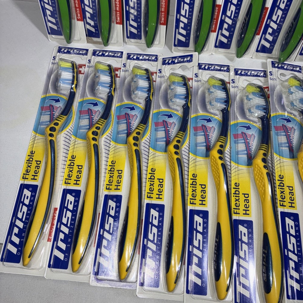 23 Trisa Flexible Head Toothbrushes/ All New