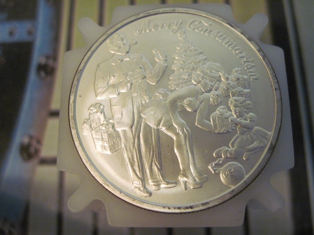 2015  1 OZ MERRY CONSUMERISM BU SILVER SHIELD