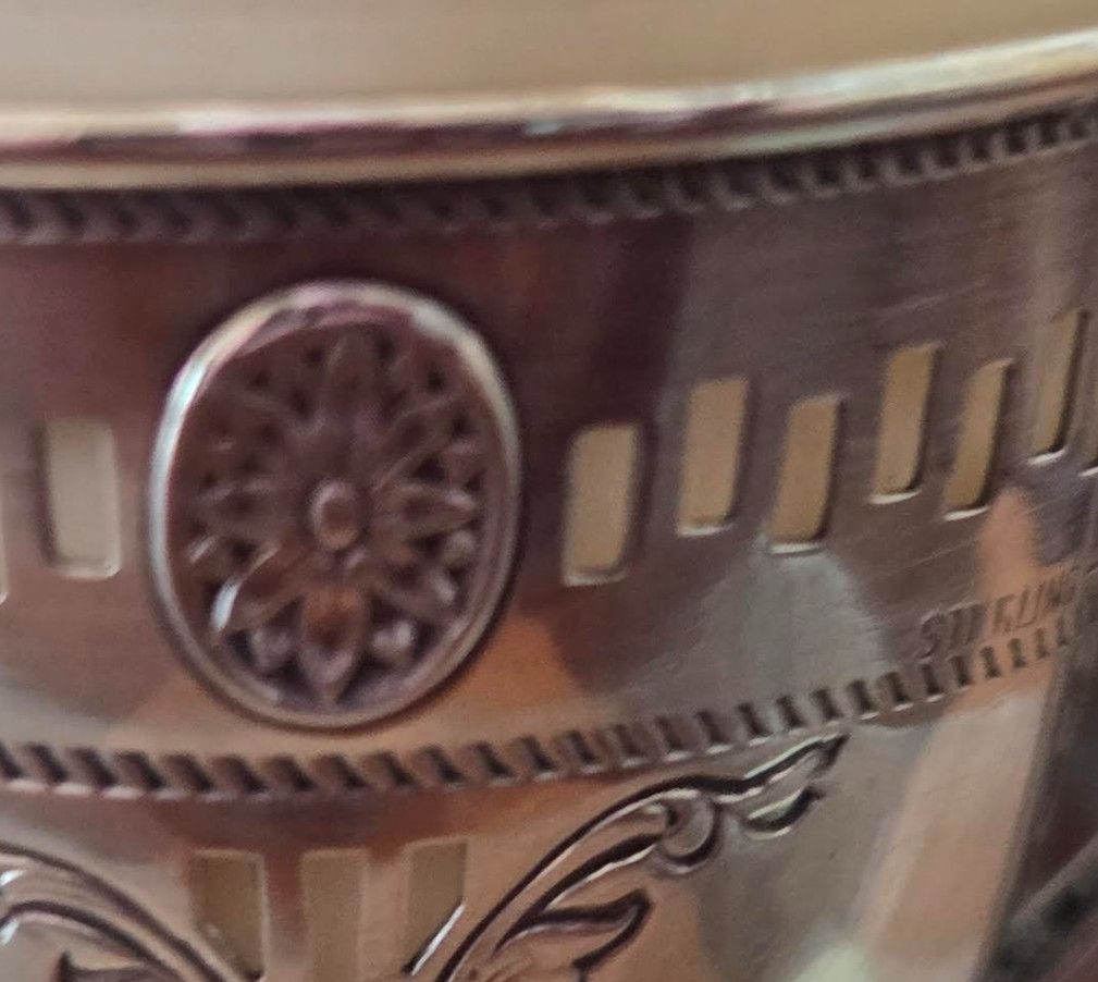 A Pair of Sterling Silver Teacups with 6 Porcelain Inserts