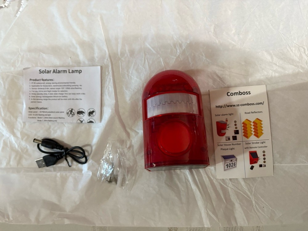 Motion activated solar alarm lamp