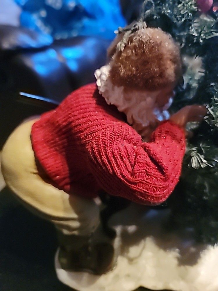 Santa Hiding By A TREE