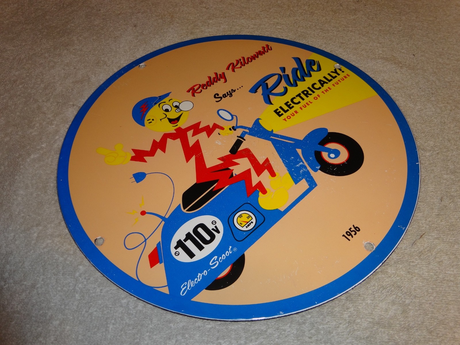 VINTAGE 56 REDDY KILOWATT ELECTRIC SCOOTER 11 3/4" PORCELAIN METAL GASOLINE SIGN