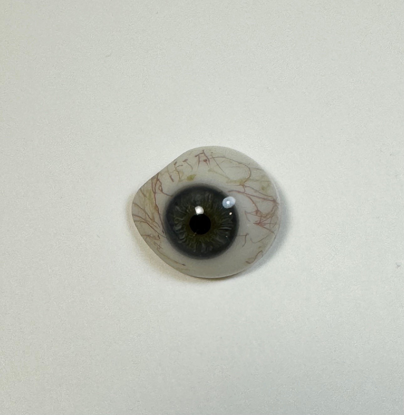 Antique German hand-blown human prosthetic glass eye. Bloodshot eye. Blue.