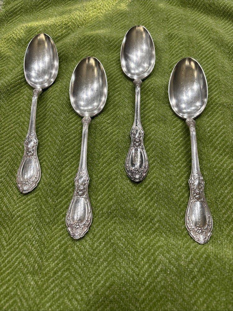4 silver plate Rogers serving spoons