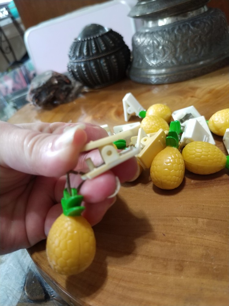 10 plastic pineapple shaped tablecloth weights. picnics, outdoor dining