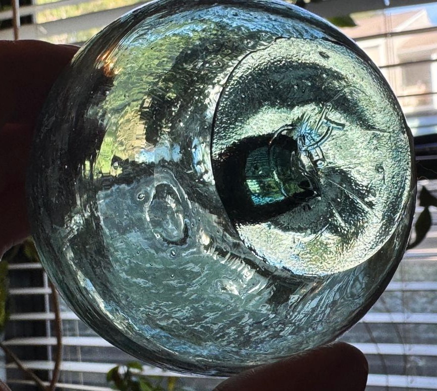 Crude aqua-green glass float, 3 1/4 inches diameter