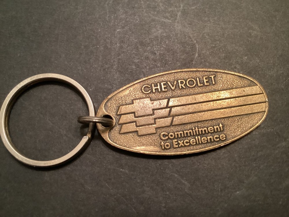 VINTAGE BRASS CHEVROLET COMMITMENT TO EXCELLENCE” RETURN POSTAGE KEY CHAIN