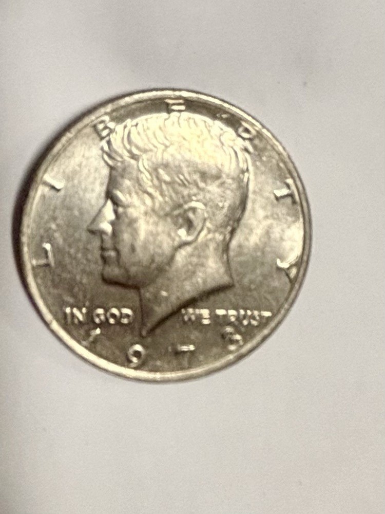 1973 Kennedy Half Dollar With No Mint Mark, Error On E