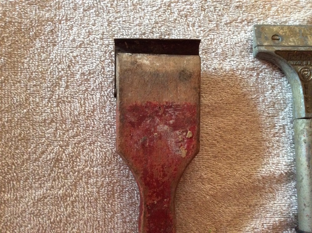 Three red Devil scraper tools