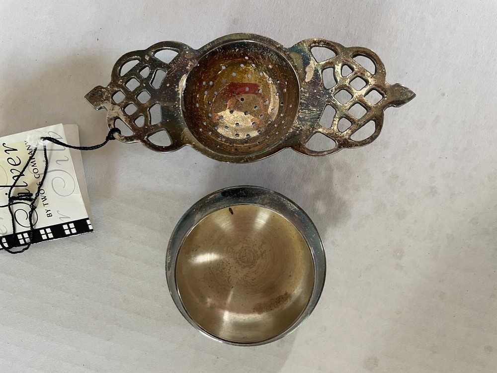 SILVER PLATE TEA STRAINER WITH ACCOMPANYING BOWL -- VERY CHARMING!