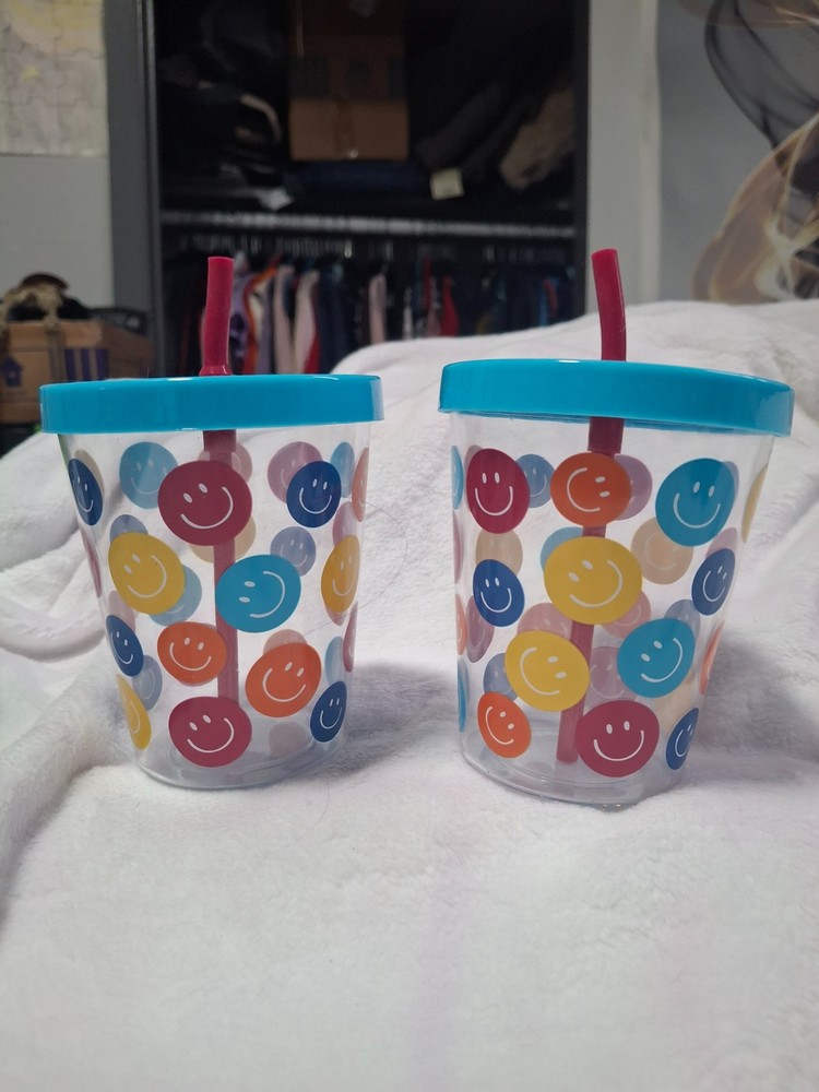Plastic cups with straws