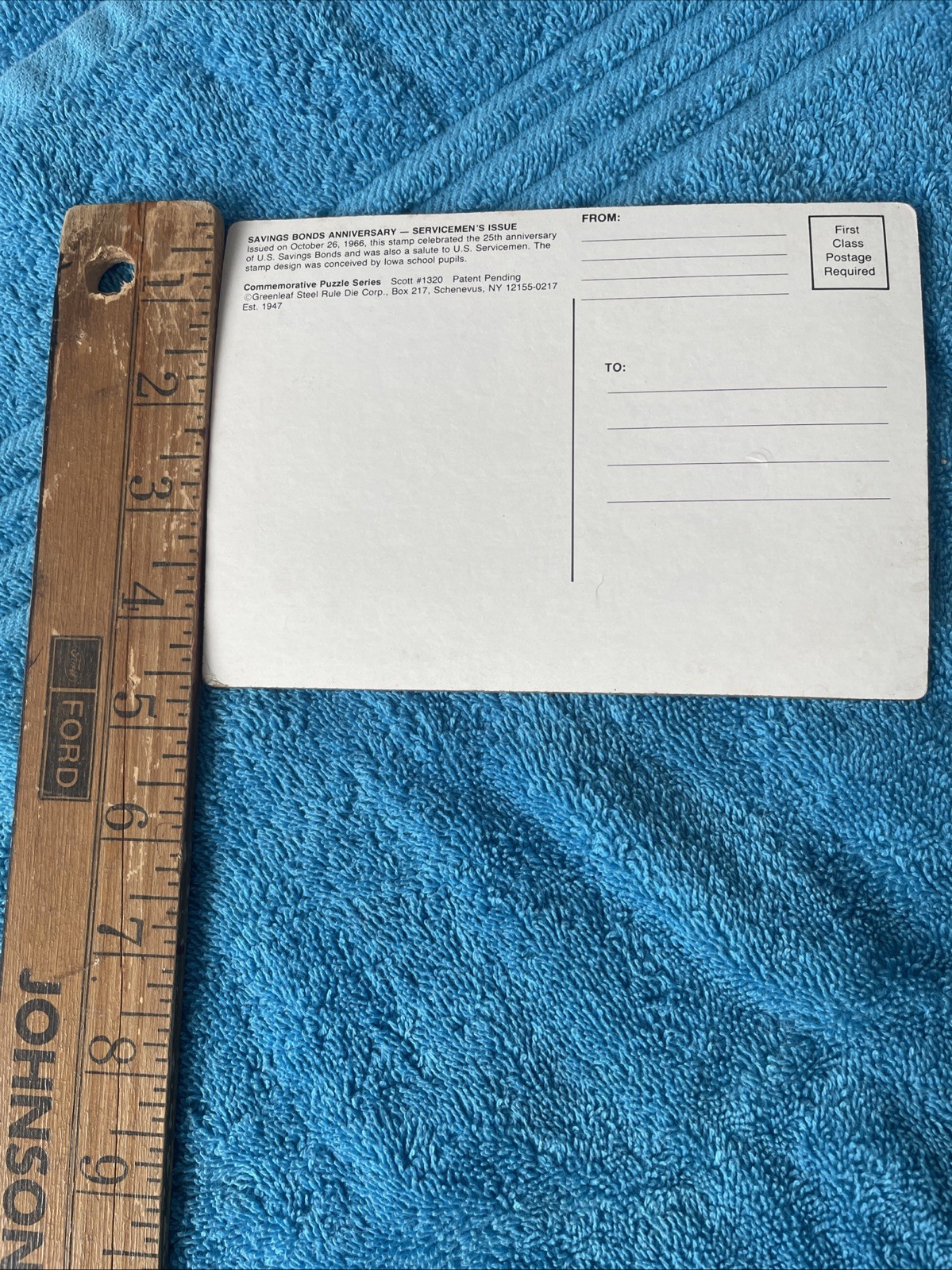 Vintage novelty puzzle resembling a US Savings Bond postage stamp.