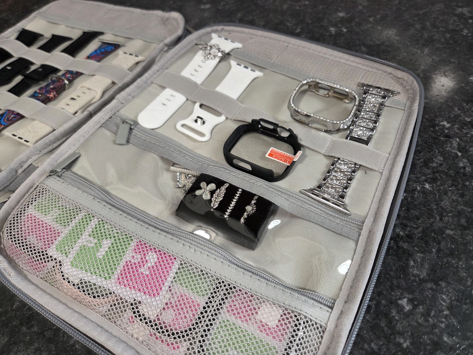 Travel Organizer Storage Case for (included) Smartwatch bands and accessories.