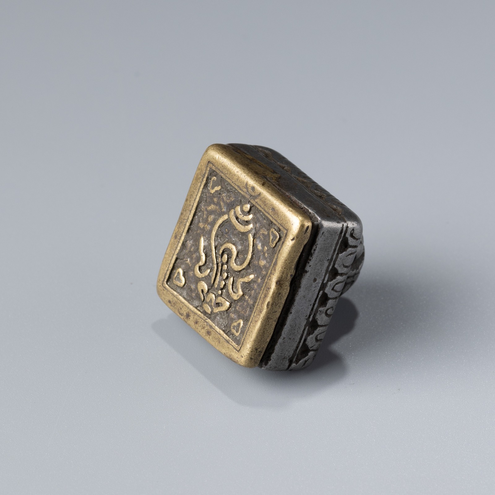 Tibetan Bronze and Iron Seal with Conch Motif